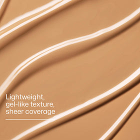 Side-by-side swatch of EltaMD tint showing subtle evening of skin tone