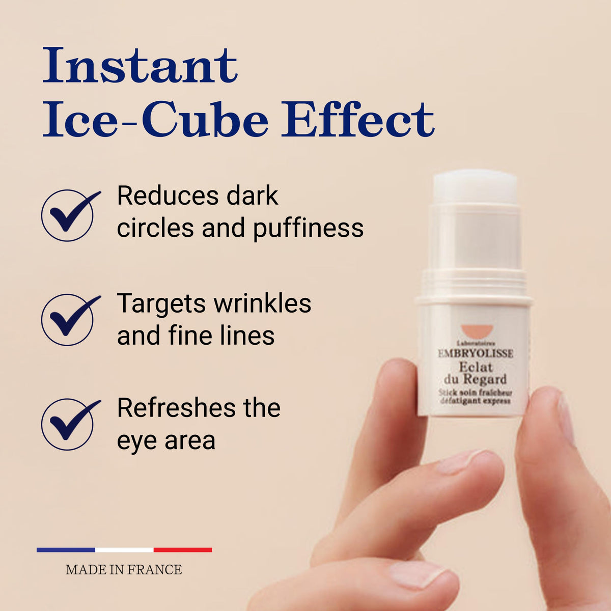 Hand applying Embryolisse Radiant Eye Stick under eye demonstrating precise targeted use