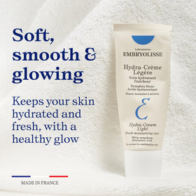 Embryolisse tube in hand for size reference showing portable skincare convenience