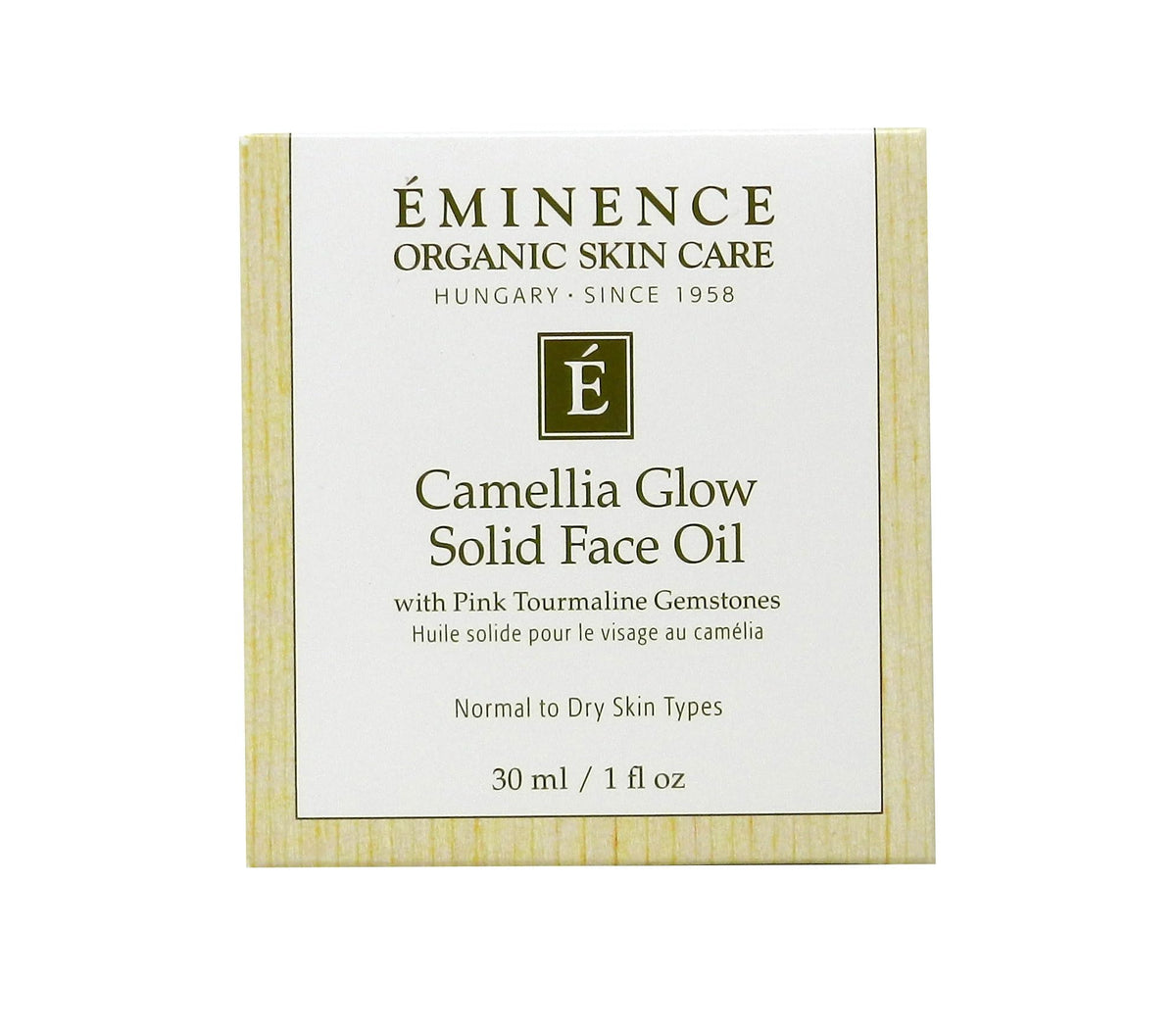 Eminence melted dab on fingertip close-up, shows smooth texture and easy spread