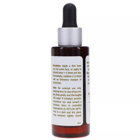 Applying Eminence serum to hand to show quick absorption benefit