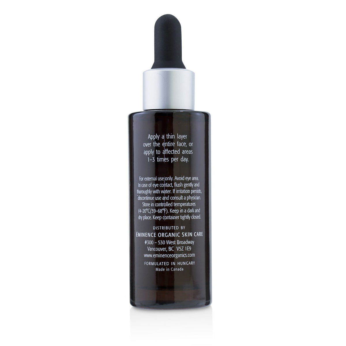 Eminence serum applied to hand during routine showing easy layering and visible hydration