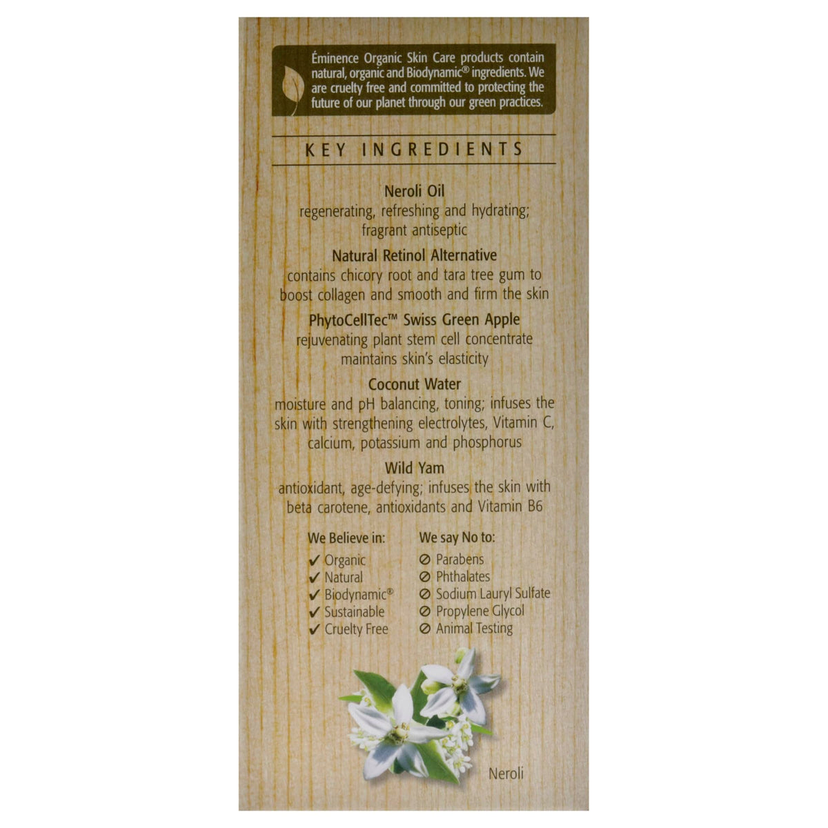 Close-up neroli blossoms next to Eminence bottle, botanical conditioning benefit