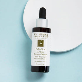 Eminence serum being applied to cheek, demonstrating soothing application