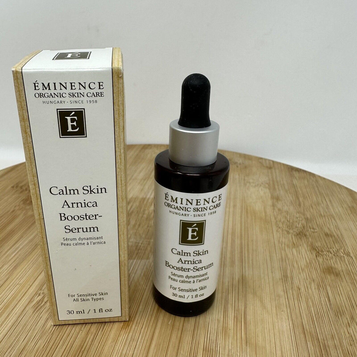 Eminence serum bottle on bathroom vanity, promoting daily routine calm