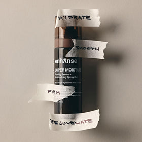 ENHANSE amber pump bottle close-up highlighting travel-ready design and protection