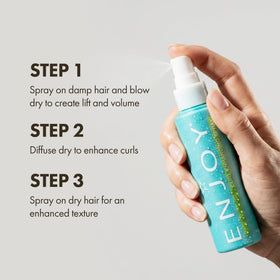Enjoy bottle next to a hand for size comparison highlighting the 3.4 oz travel-friendly benefit