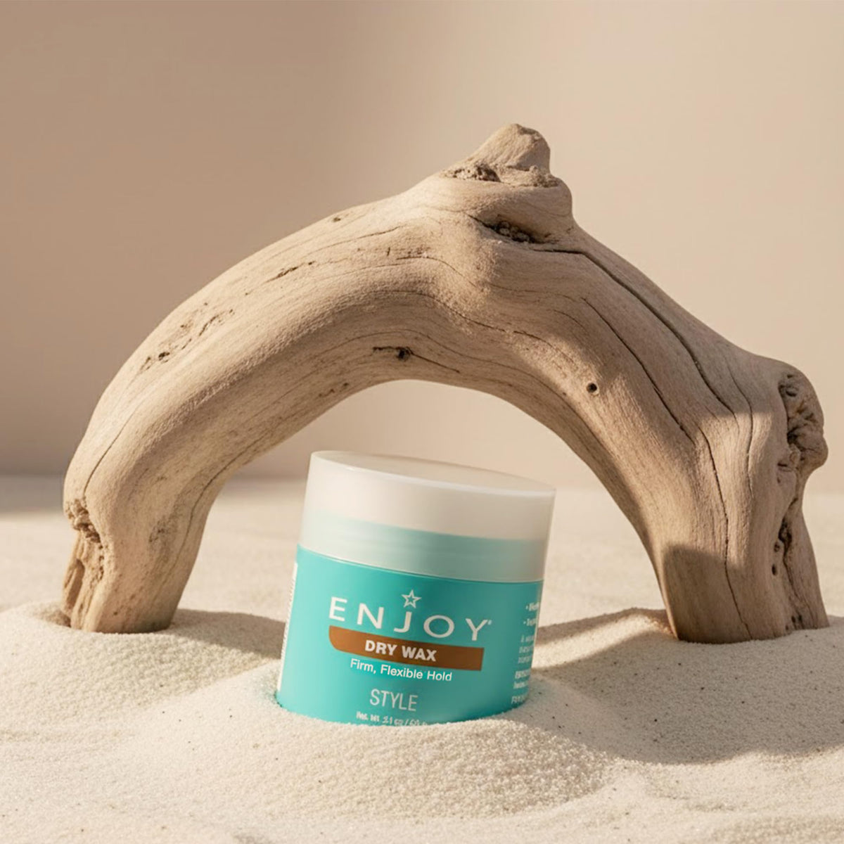 Enjoy dry wax travel size in hand showing compact 2.1 oz tub for on-the-go styling