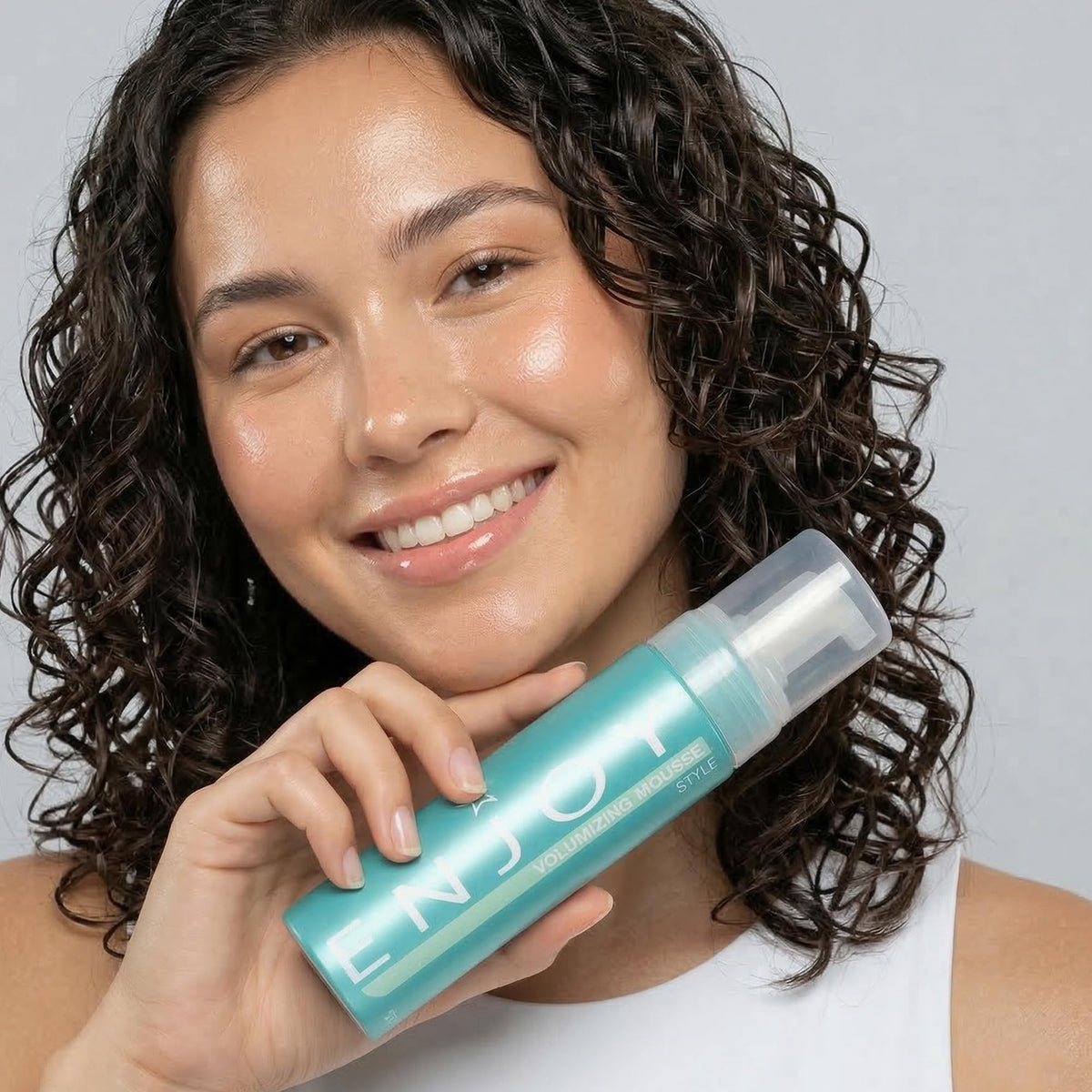 Enjoy mousse label close-up highlighting ingredients and usage benefits