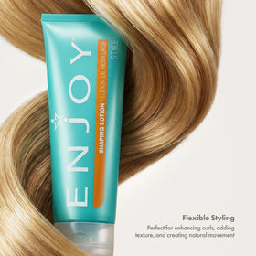 Enjoy shaping lotion in hand scale showing 8 oz size and travel-friendly convenience
