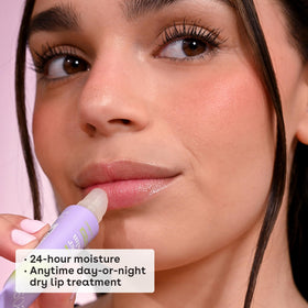 eos duo shown in hand to demonstrate compact size and convenient on-the-go lip care