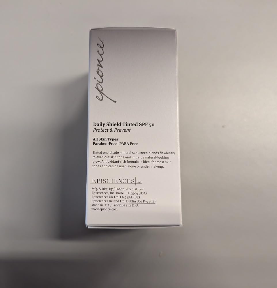 Epionce tube next to hand for scale showing portable size benefit
