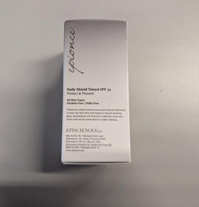 Epionce tube next to hand for scale showing portable size benefit