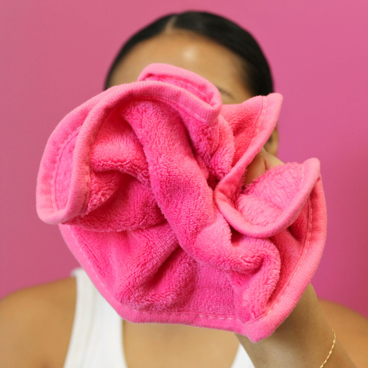 ERASE YOUR FACE size comparison in hand showing compact travel-friendly benefit