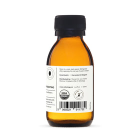 Erbology recyclable glass bottle on neutral background promoting sustainable packaging