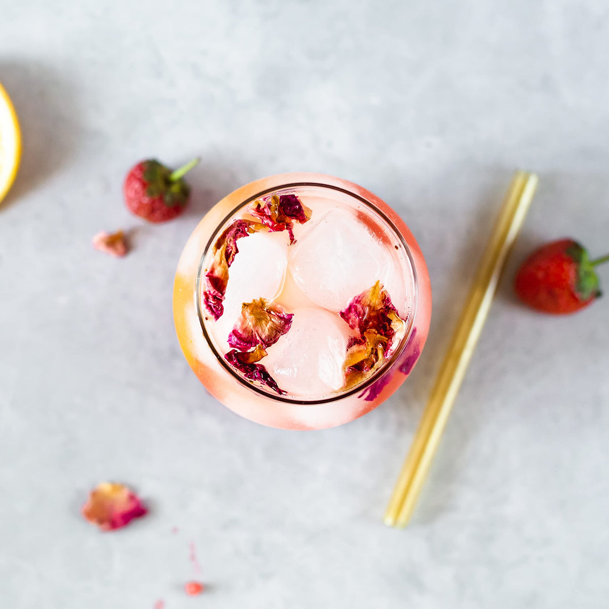 Erbology misting rose water onto skin as a gentle toner for cooling hydration