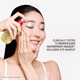 Erborian cleansing oil shown on hand while massaging to remove waterproof makeup effectively