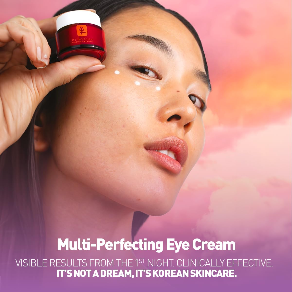 Erborian model applying cream to under-eye demonstrating gentle massage benefit