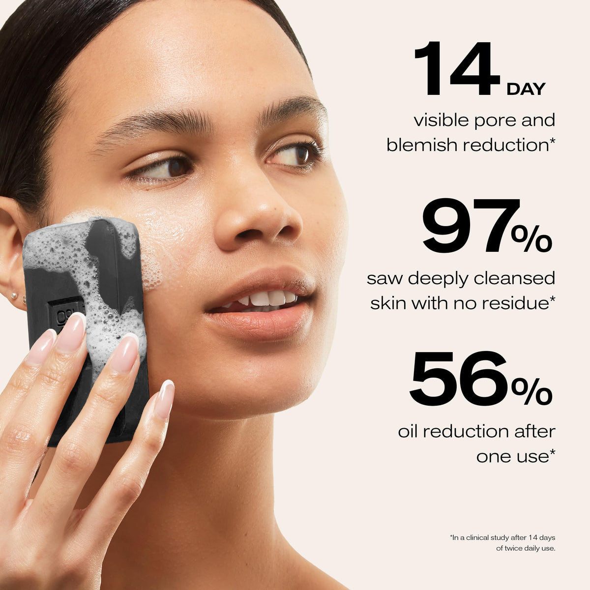 Erno Laszlo lathered bar in hand showing creamy foam that helps remove impurities