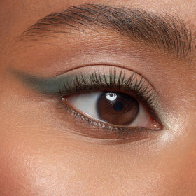 essence applying brown mascara to lashes for natural length and lift