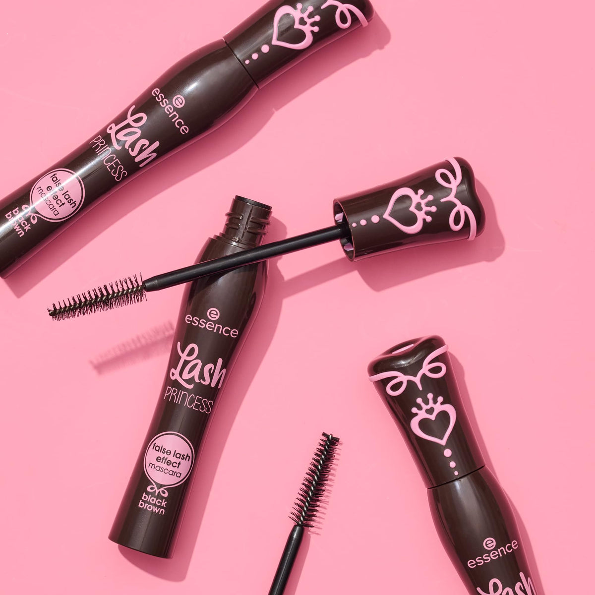 essence mascara next to hand for scale and travel-friendly size