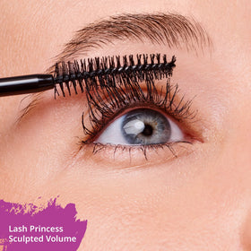 Essence Cosmetics mascara tube in hand for scale showing travel-friendly size