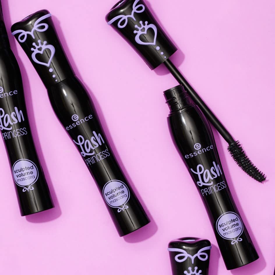 Essence Cosmetics mascara next to makeup bag and mirror for on-the-go touch-ups