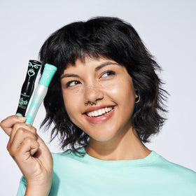 essence primer held in hand for scale and portability benefit