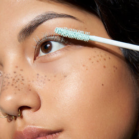 essence light-green primer texture on brush for buildable coverage