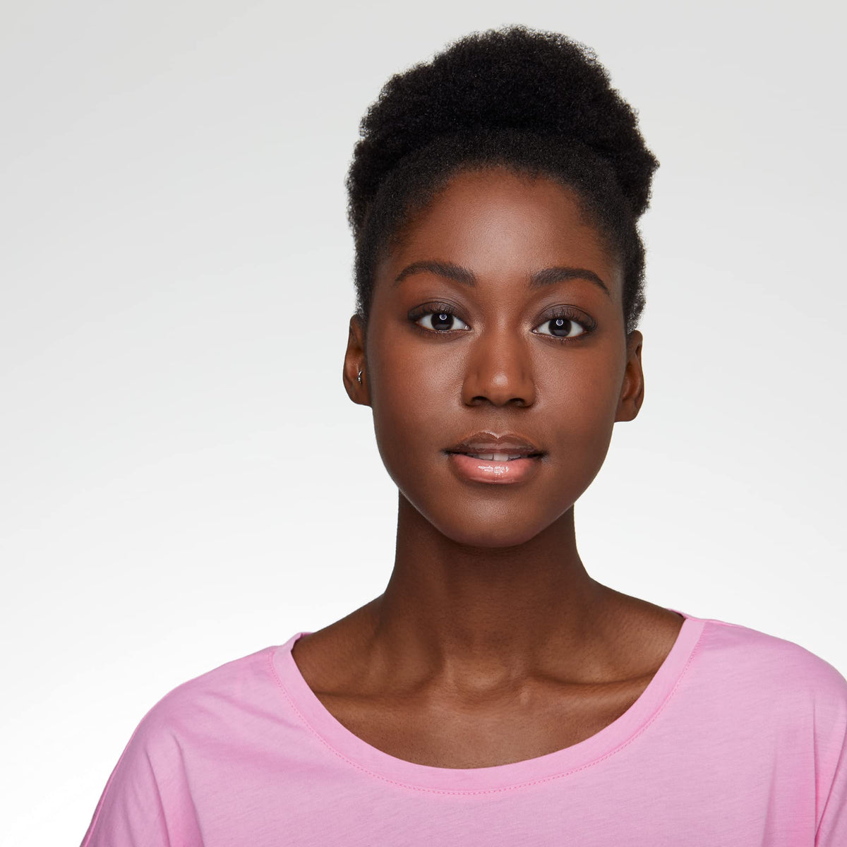 essence on-model lips wearing gloss showing high shine and fuller appearance