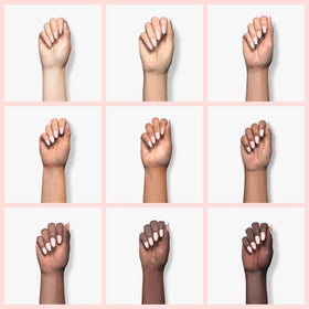 essie painted nails in hand pose showcasing natural, elegant manicure