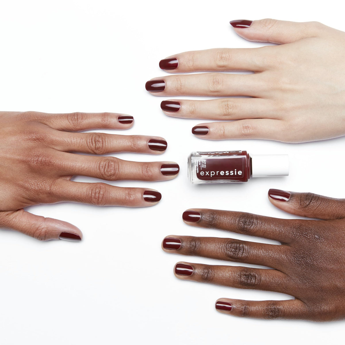 essie expressie swatch on nail tip showing deep blackened burgundy pigment
