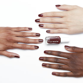 essie expressie swatch on nail tip showing deep blackened burgundy pigment