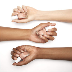essie swatch on fingertips demonstrating buildable nude color and everyday polish