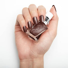 essie lifestyle flatlay with outfit pairing illustrating versatile shade for stylish looks