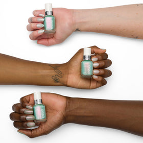 essie manicured hand wearing Mystic Marine showing reflective chrome effect