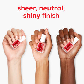 essie bottle next to coin for scale indicating compact travel-friendly size