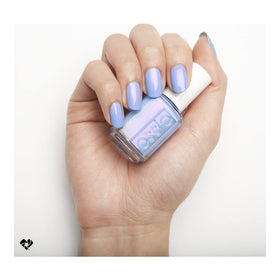 essie polished nails lifestyle shot wearing periwinkle blue for wearable, salon-quality finish