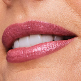 Estée Lauder texture swatch of 223 Candy revealing shimmer finish and smooth coverage benefit