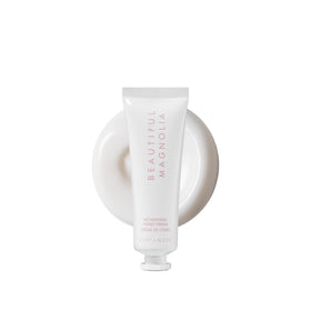 Estée Lauder Beautiful Magnolia tube front view showing elegant packaging and portability benefit