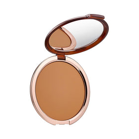 Estée Lauder front compact showing matte bronzer, convenient portable warmth