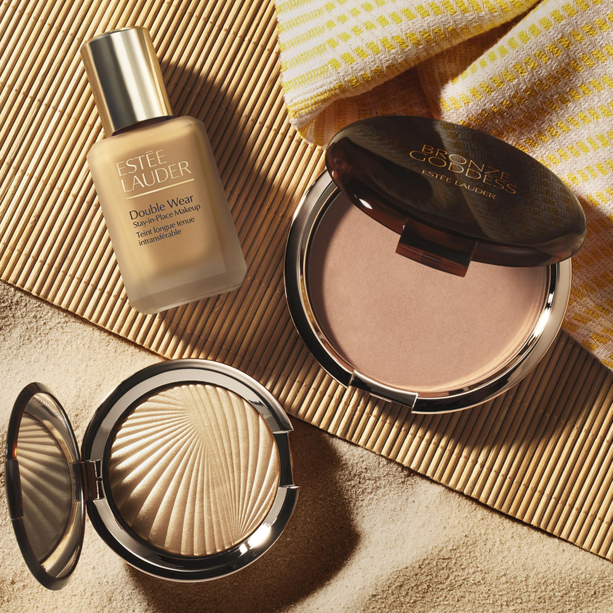 Estée Lauder compact beside a coin to show size and travel-friendly scale