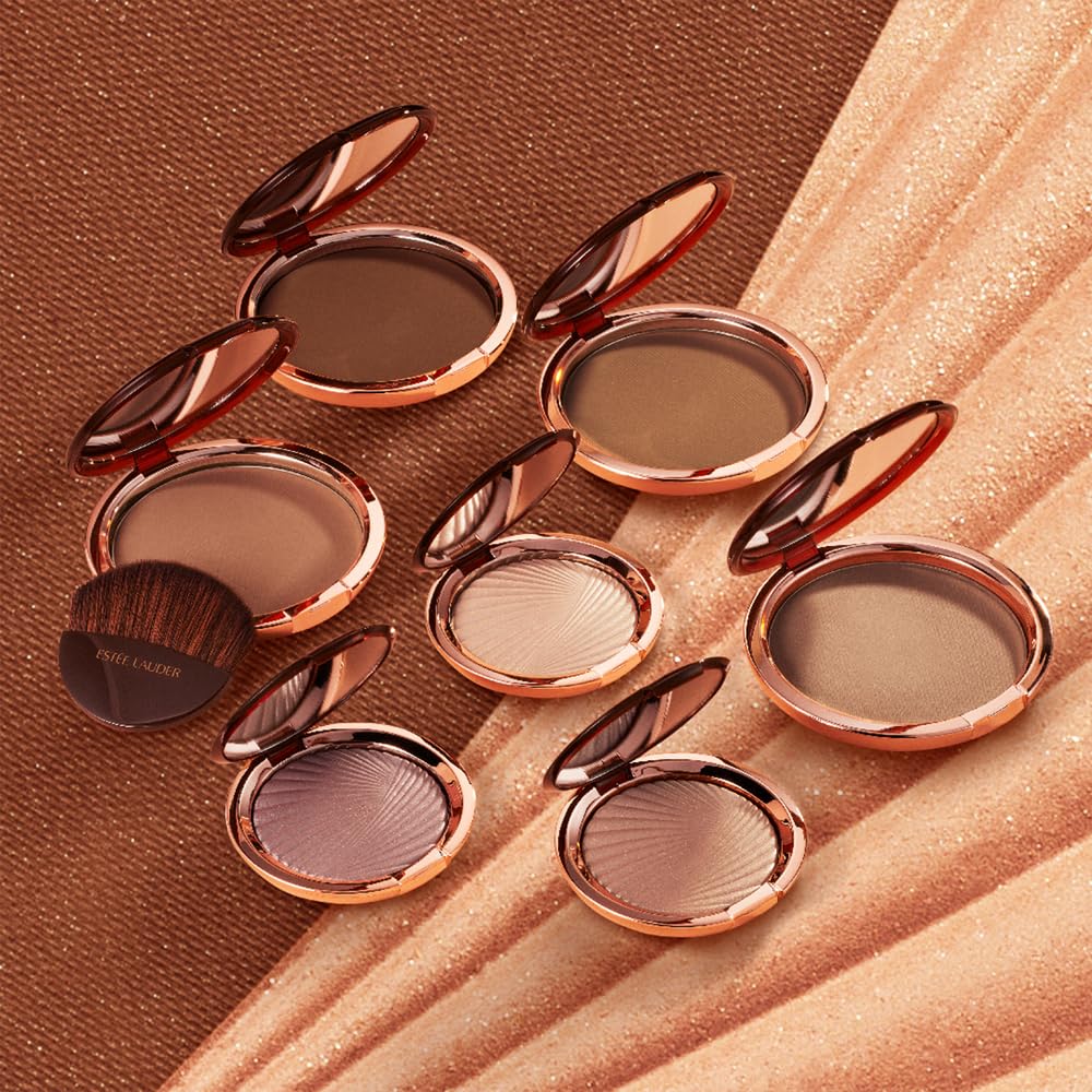Estée Lauder bronzer blended on shoulders and décolletage showing body use benefit: cohesive sun-kissed look