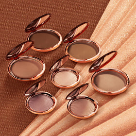 Estée Lauder bronzer on shoulders and décolletage adding natural warmth