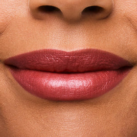 Estée Lauder bullet close-up revealing creamy texture and shimmer for smooth, precise application