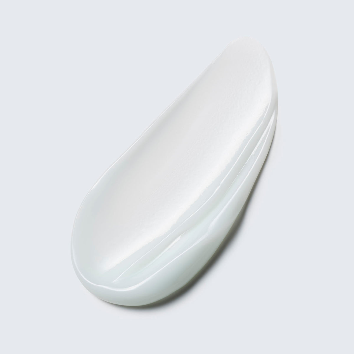 Estée Lauder jar in hand showing 1.7 oz scale and travel convenience