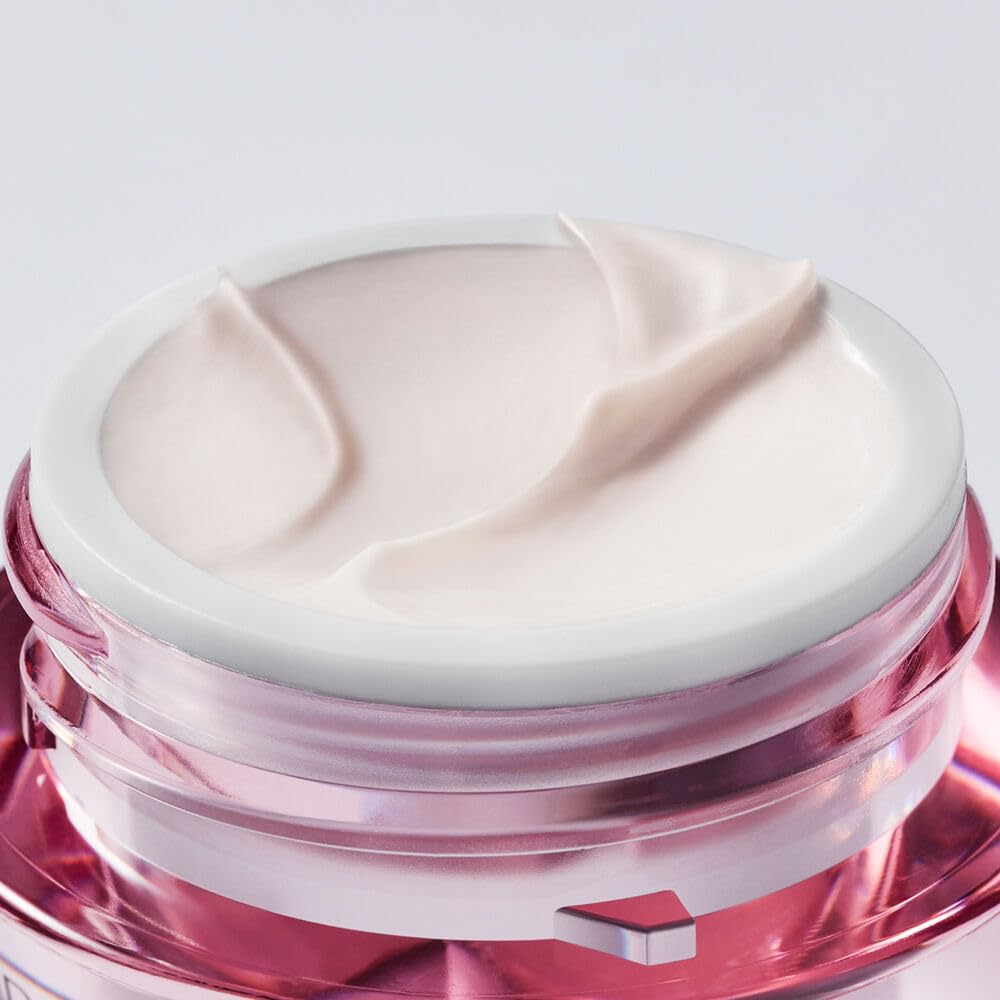 Estée Lauder applying cream to back of hand demonstrating easy absorption
