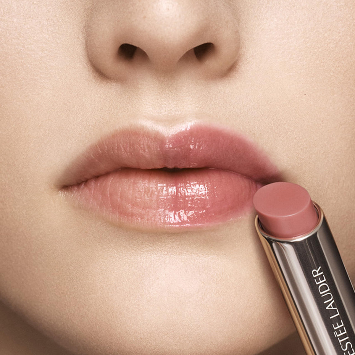 Estée Lauder open twist-up balm highlighting applicator and easy, precise application benefit
