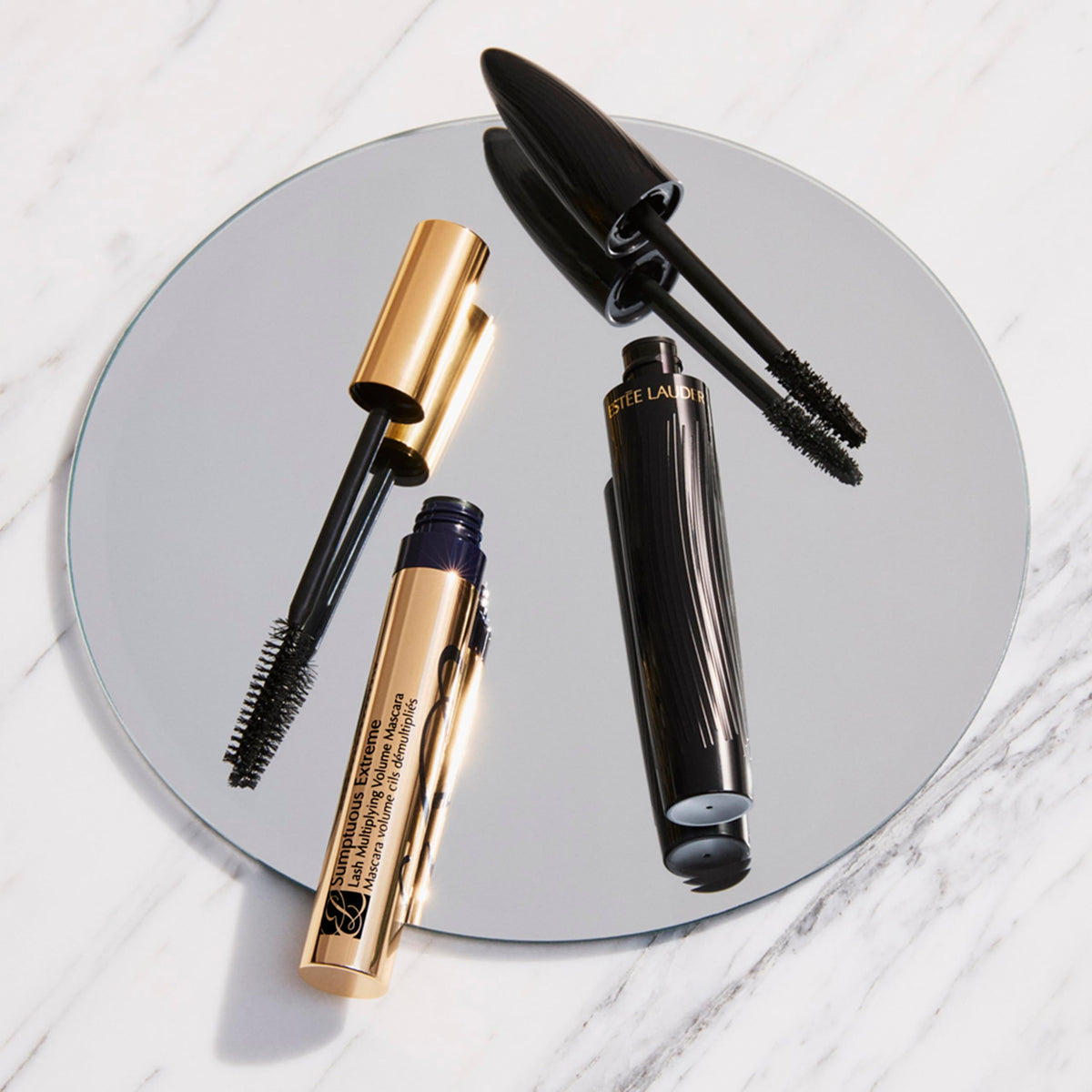Estée Lauder product held in hand to show compact 0.27 fl oz size for travel convenience