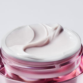 Estée Lauder open jar top view revealing creamy formula for overnight use